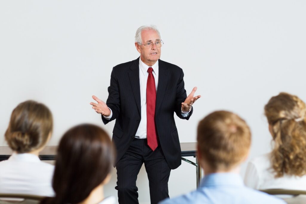 Senior business man giving a lecture